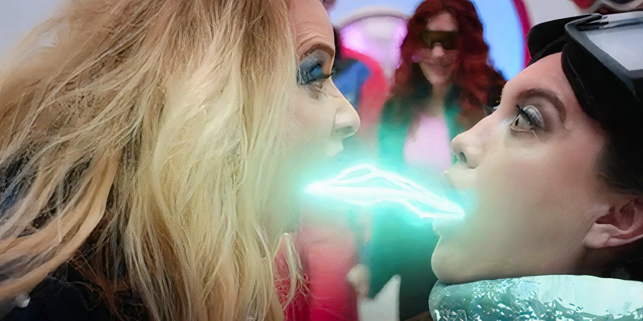 Barbara Crampton's Jacqueline shooting a blue energy into Alison's mouth in The Blue Diamond Image