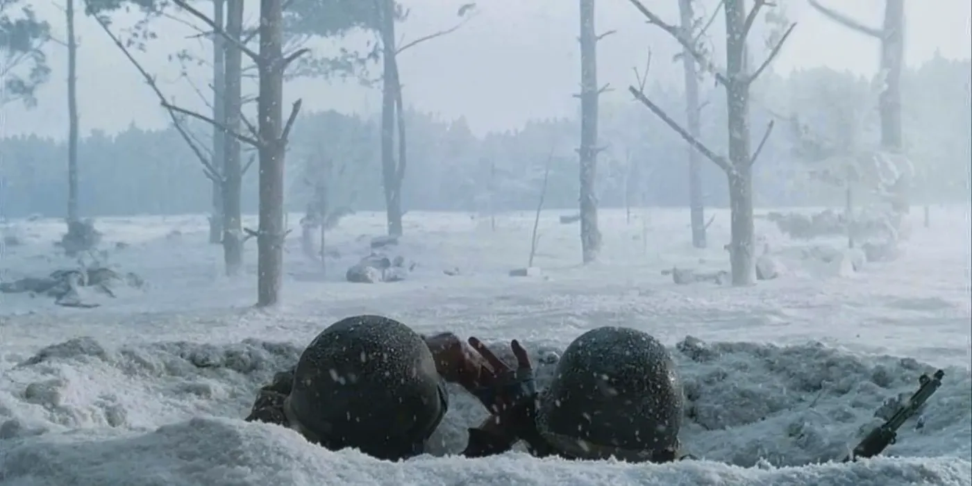 Bastogne Band of Brothers soldiers in wintry trench in Ardennes just helmets visible Image