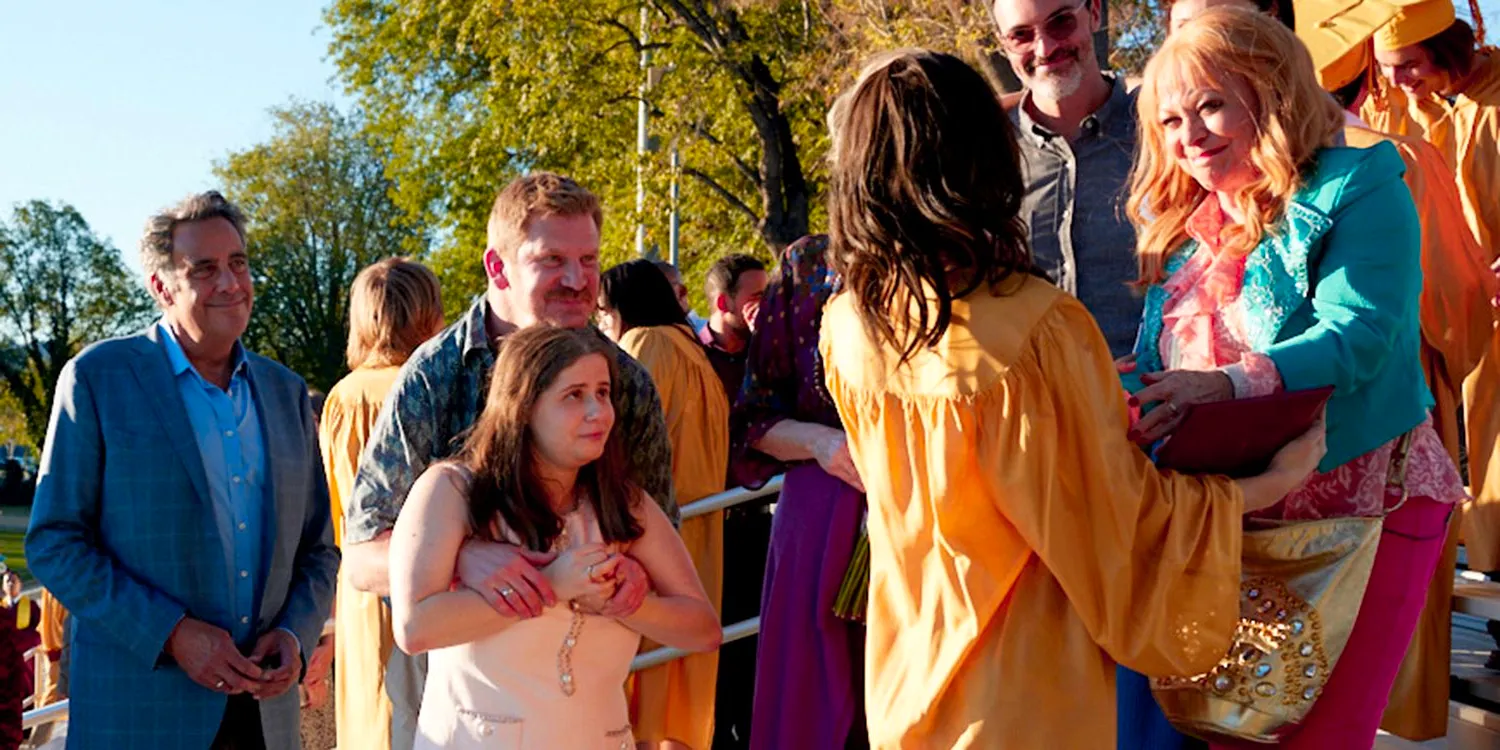 Bea's family celebrates her high school graduation. Image