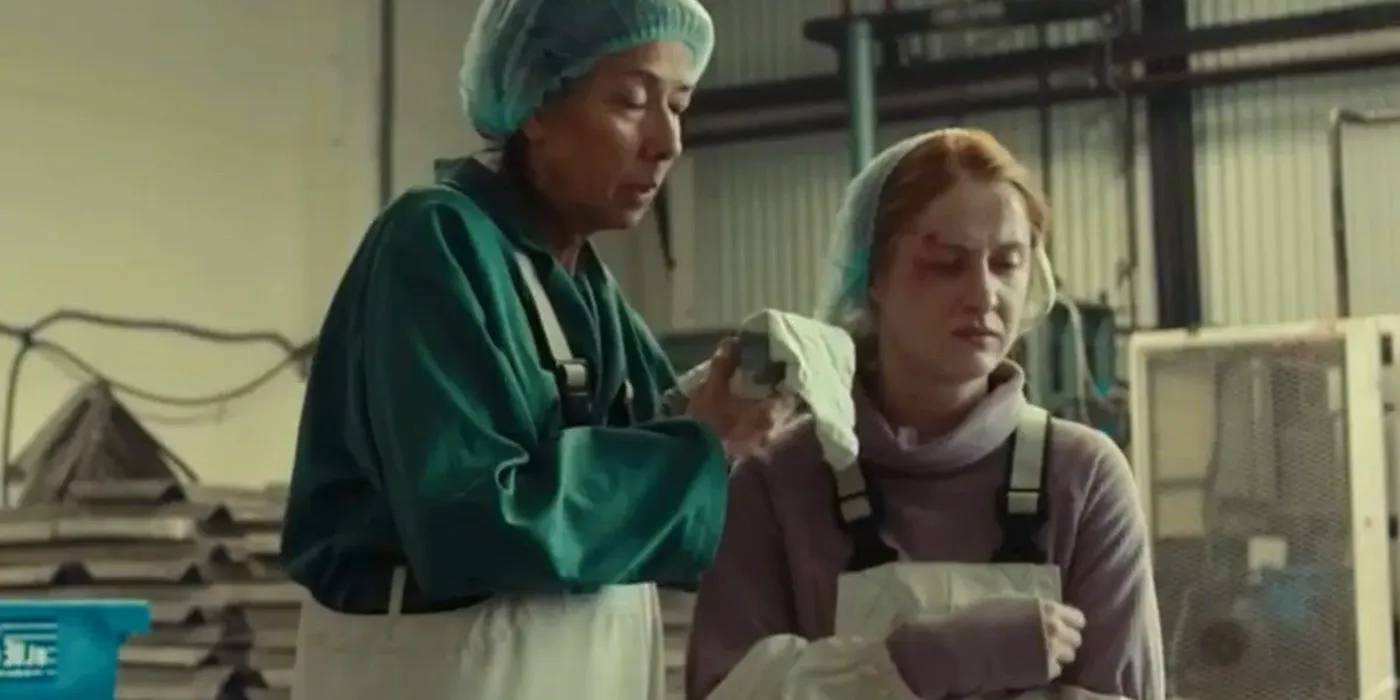 Bee cleaning Blair's wounds in True Detective: Night Country Image