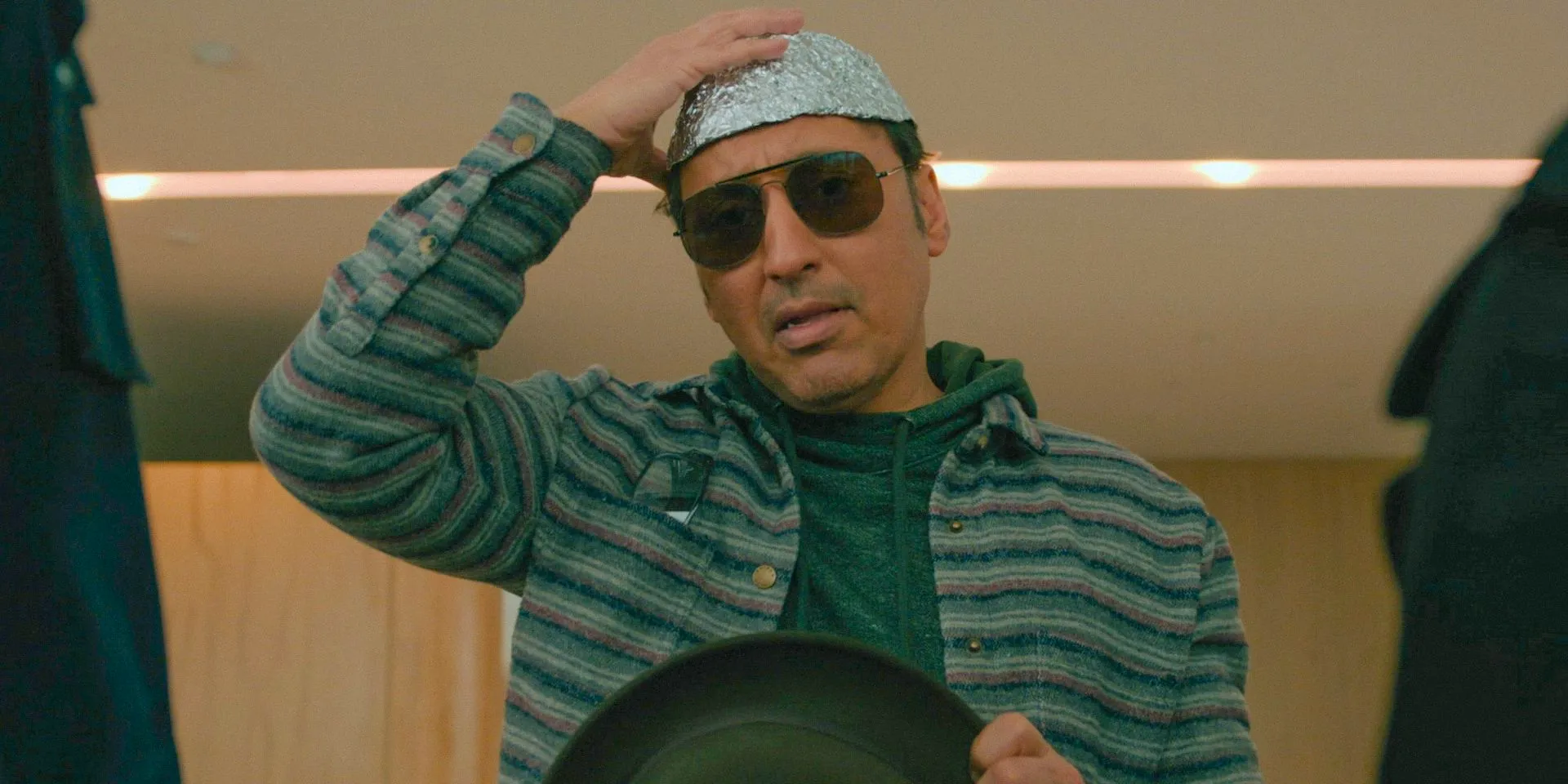 Ben Shakir (Aasif Mandvi) wearing a tin foil hat in Evil Season 4 Episode 9 Image