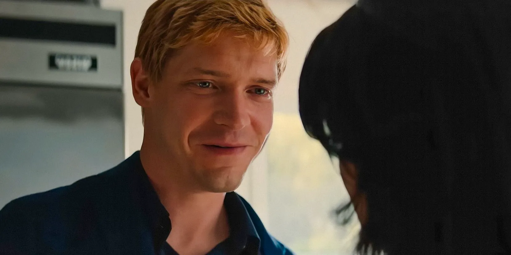 Benji Winbury (Billy Howle) smiling at his girlfriend in The Perfect Couple Image