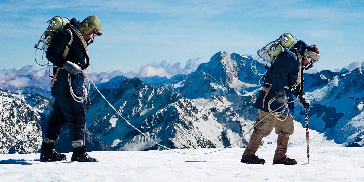 Beyond The Edge-1 Two Men Are Treking Along A Mountain on everest Image