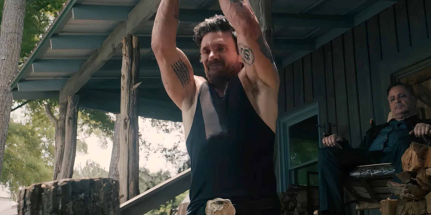 Bill Bevilaqua (Frank Grillo) chopping a log in Tulsa King season 2 Image