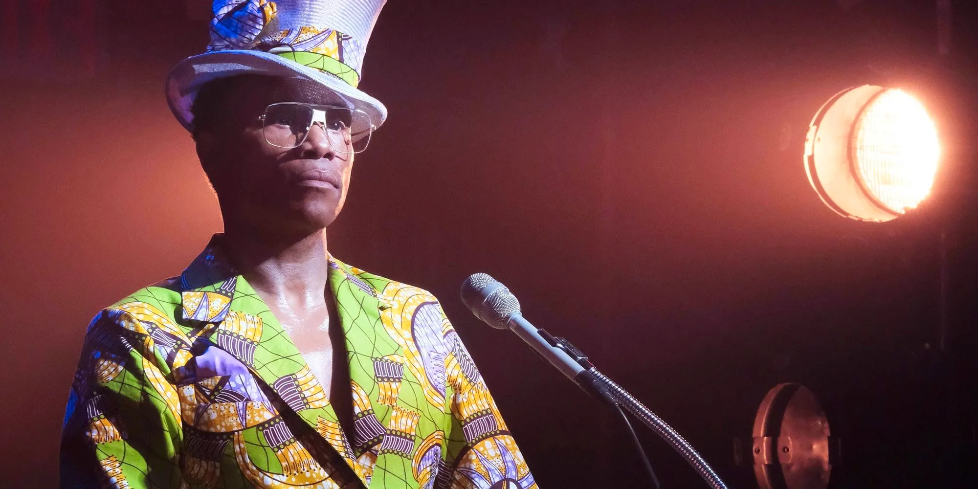 Billy Porter standing at a microphone in FX's Pose Image