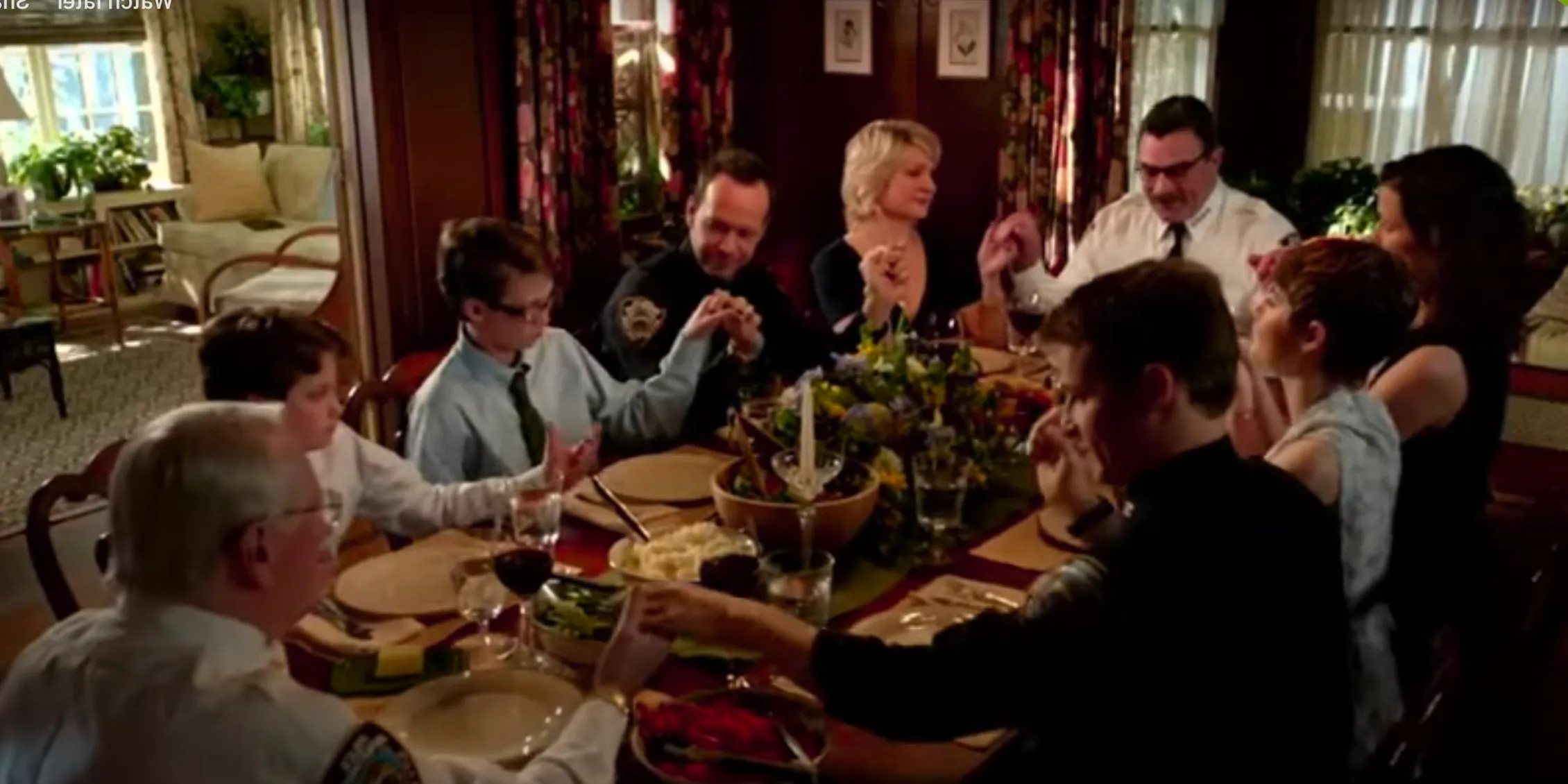 Blue Bloods everyone holding hands to say Grace at the Reagan family dinner  Image