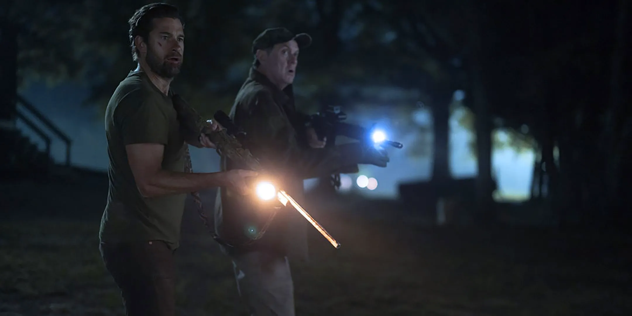 Boris McGiver as Donald Kelly, Scott Speedman as James Chenoweth aiming their rifles at something in Teacup Image