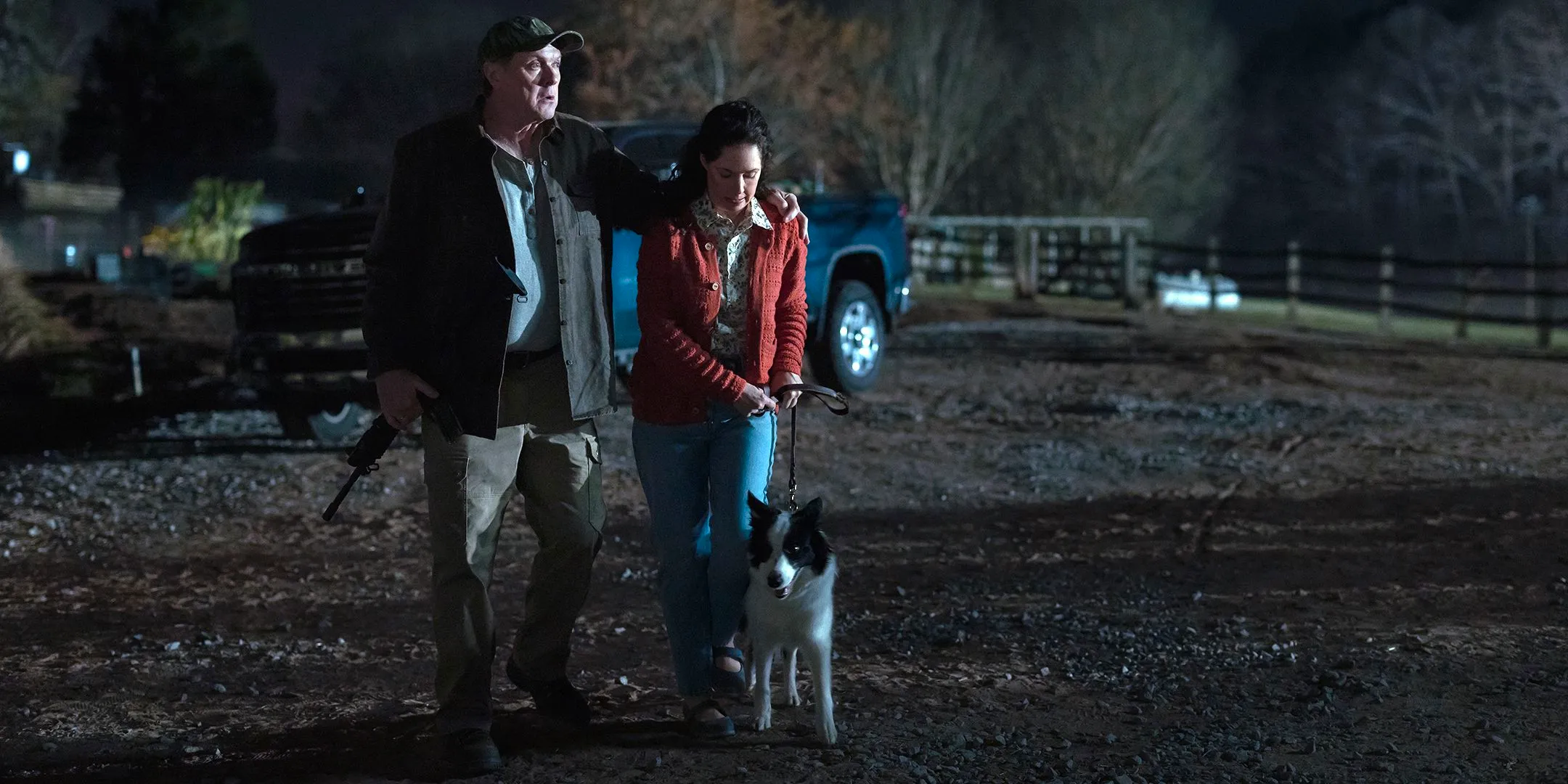 Boris McGiver as Donald looking afraid and Ashley Shelton as Mary Alice looking down at her dog in Teacup Image