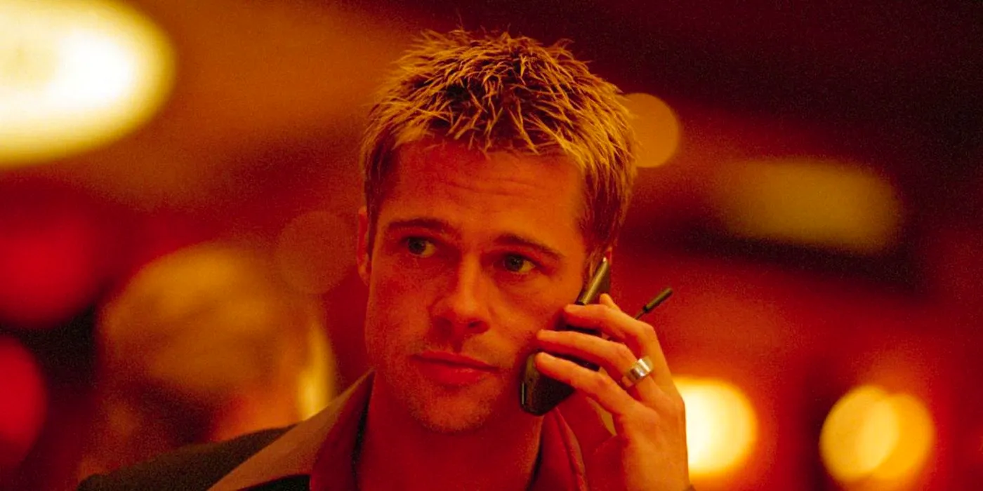 Brad Pitt on the phone in Ocean's Eleven Image