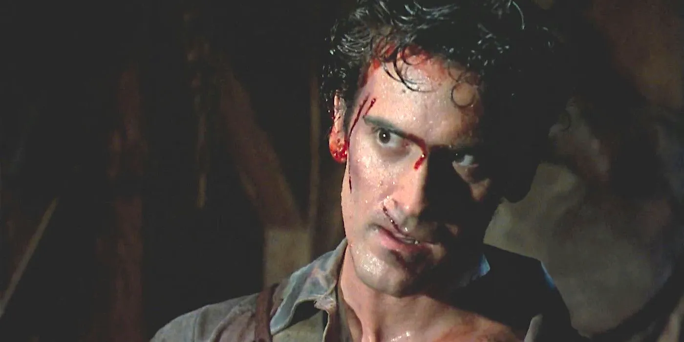 Bruce Campbell as Ash in Evil Dead 2 all covered in sweat with his face cut up and bloody Image