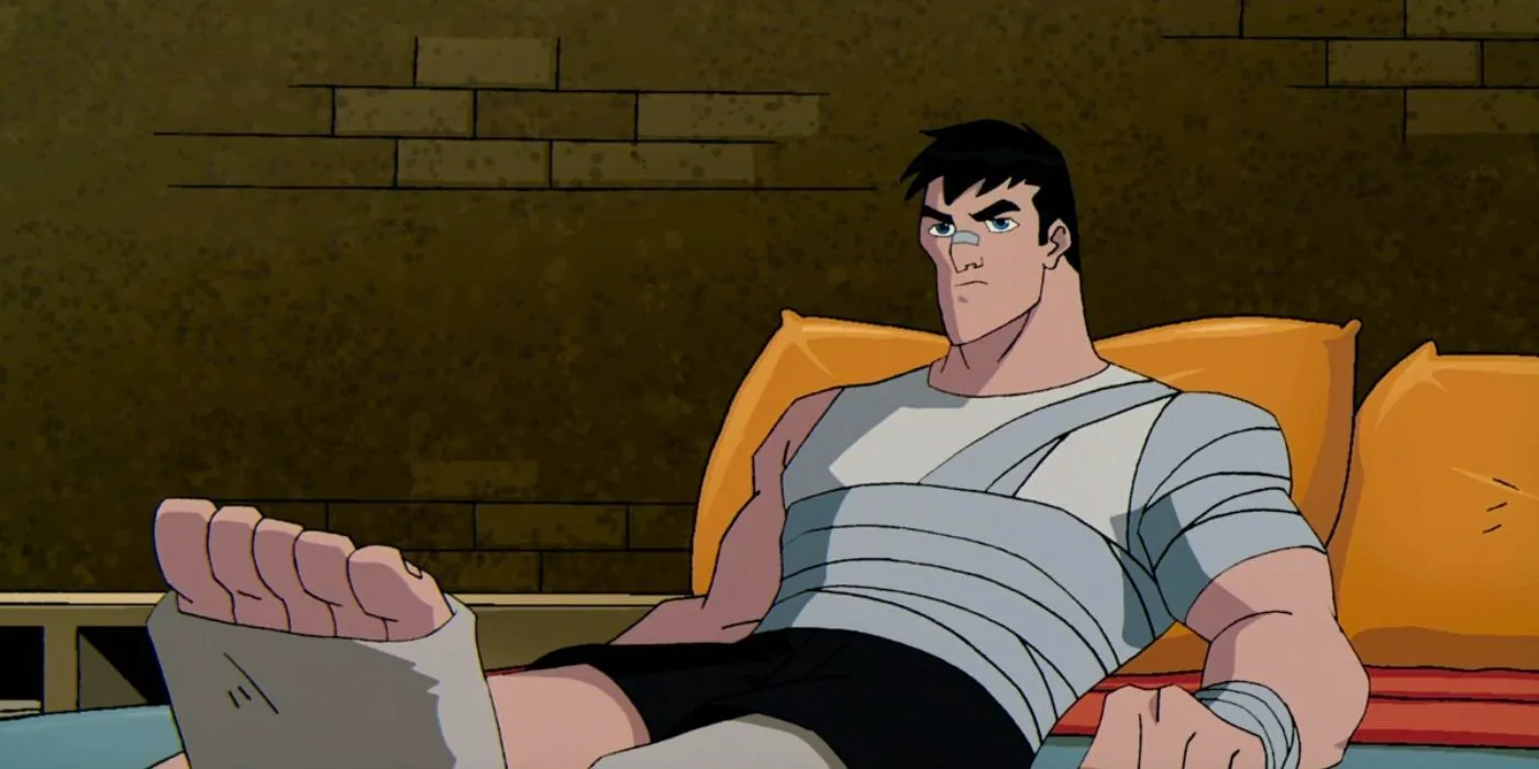 Bruce Wayne laying grumpily on the bed, bandaged and fractured in The Batman Image