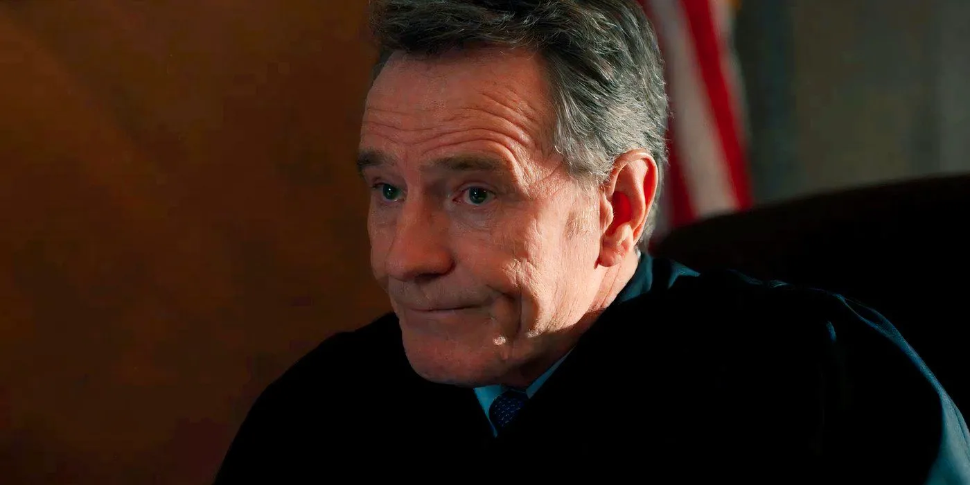 Bryan Cranston as Michael Desiato Giving a Tight Smile in Your Honor Season 1 Image