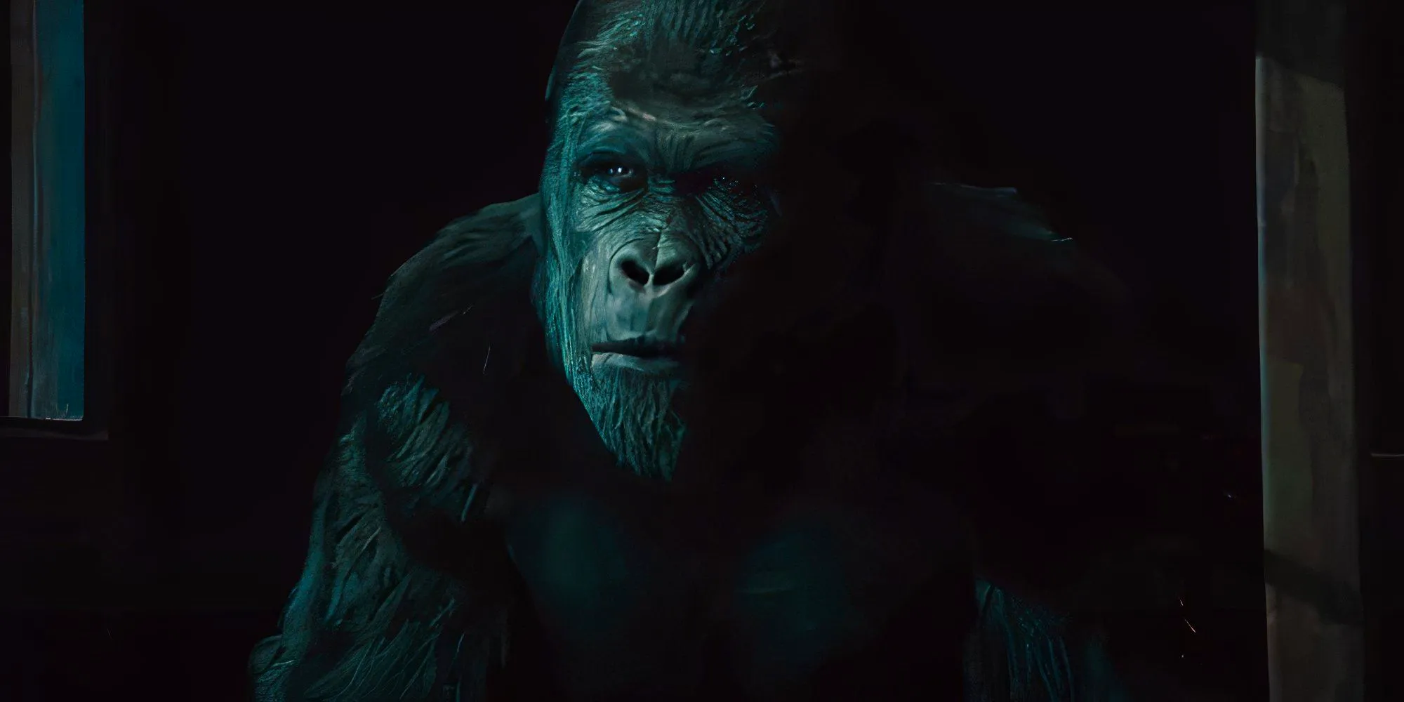 Buck in his cage at night in Rise of the Planet of the Apes Image