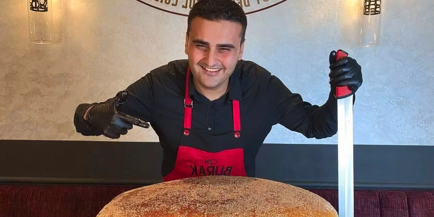 Burak Ozdemir making a supersized burger on TikTok Image