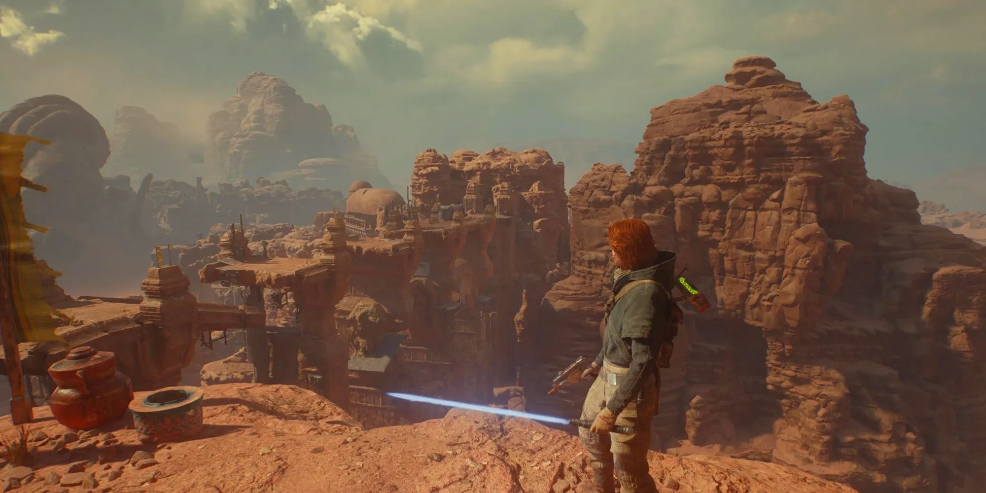 Cal Kestis standing on a cliff overlooking Jedi ruins on Jedha in Star Wars Jedi: Survivor. Image