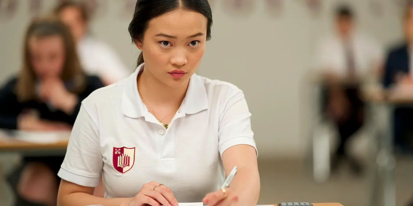 Callina Liang sitting at a desk with a book in Bad Genius Image