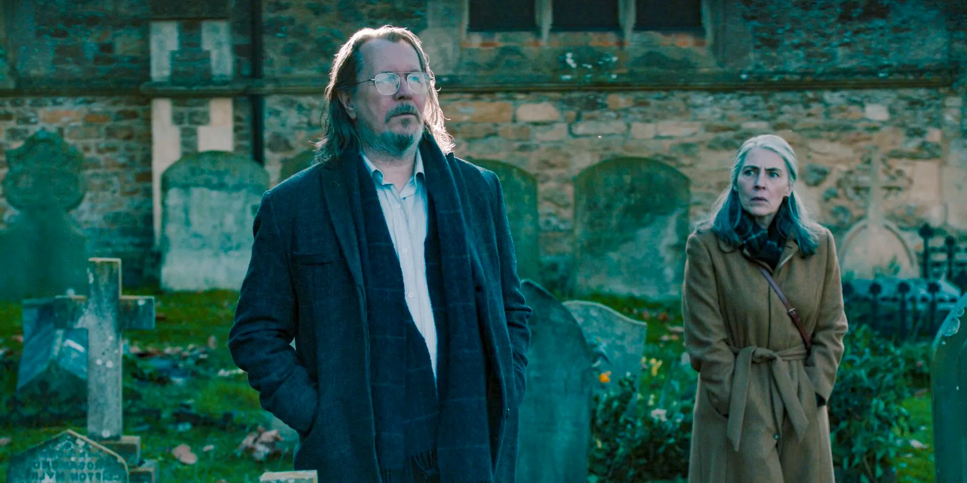 Catherine Standish (Saskia Reeves) and Jackson Lamb (Gary Oldman) at the cementery in Slow Horses Season 4 Episode 5 Image