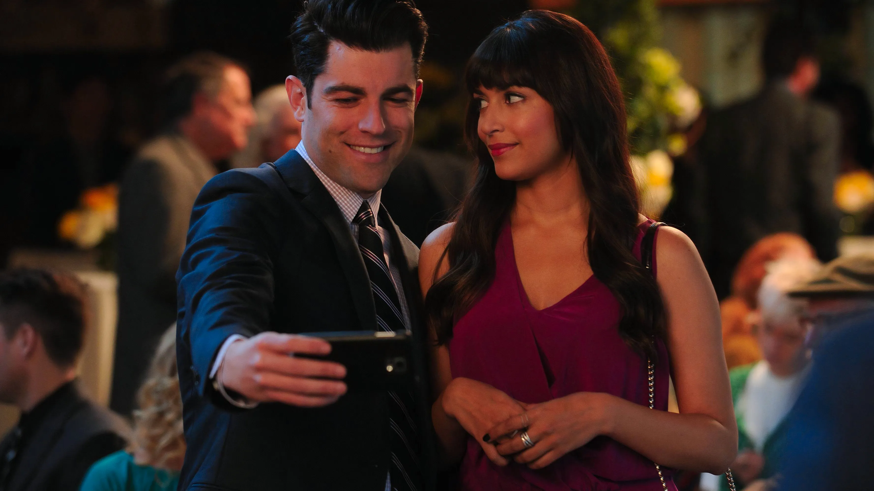 Cece and Schmidt taking a photo together in New Girl Image