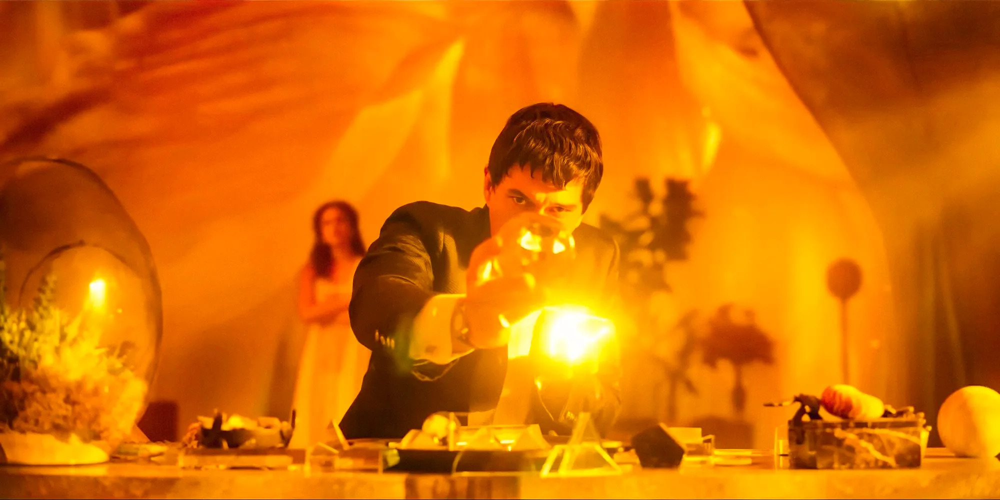 Cesar Catilina (Adam Driver) experimenting with light bulbs in Megalopolis (2024) Image