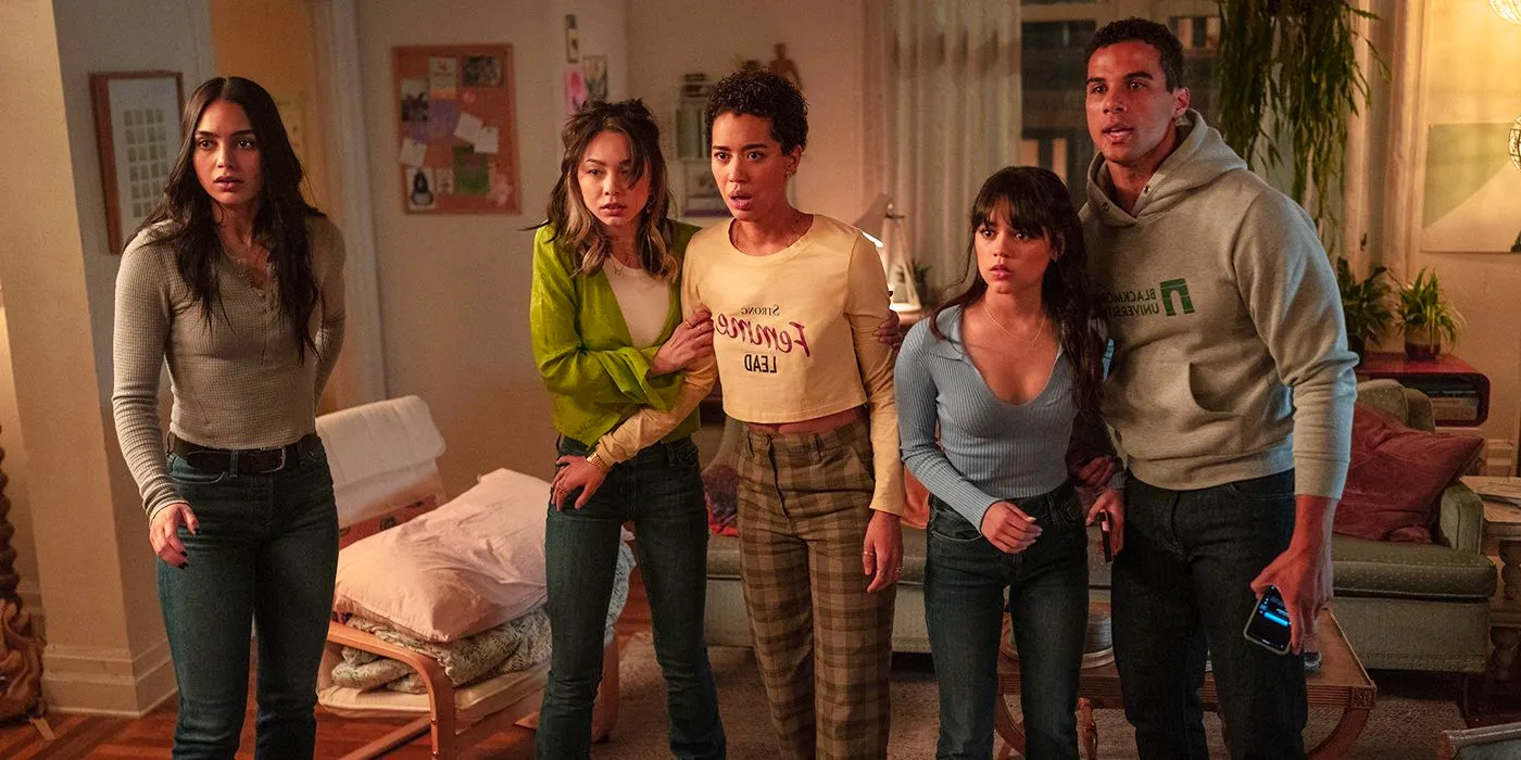 Chad, Mindy, Anika, Sam, and Tara looking scared in the living room of their apartment in Scream 6 Image