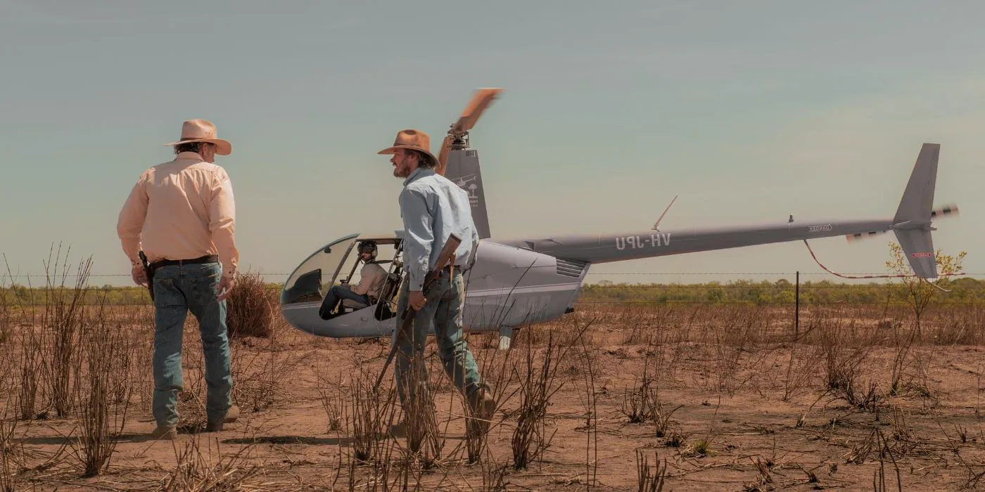 Characters in front of a helicopter in Territory Image