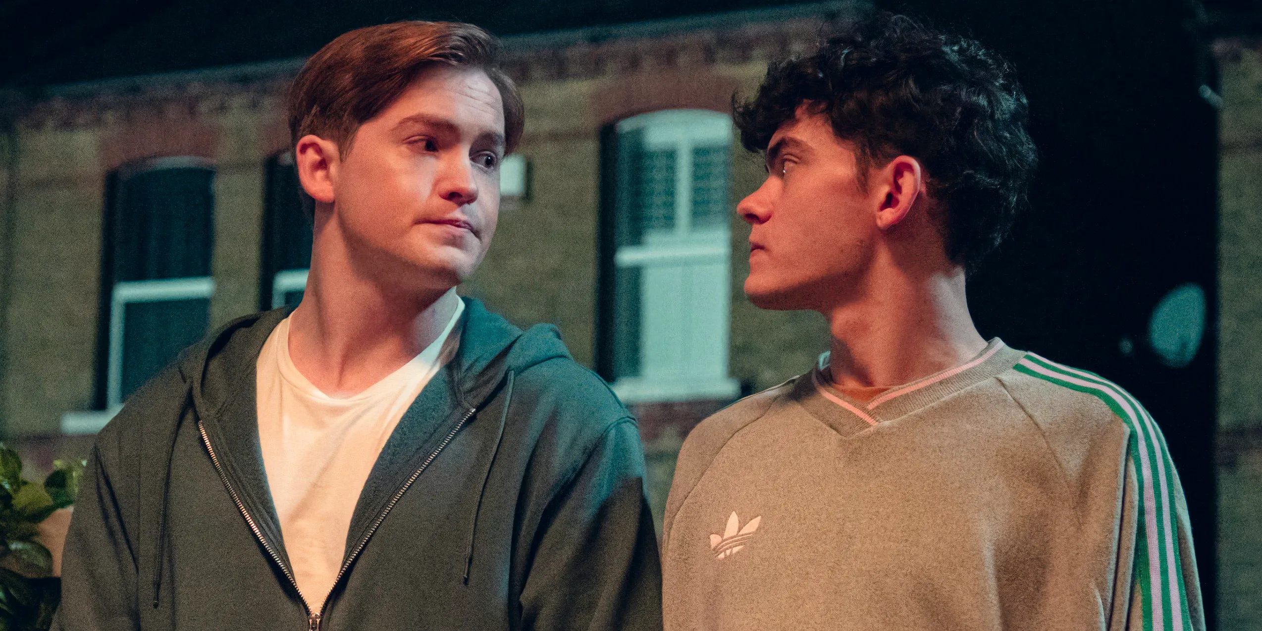 Charlie (Joe Locke) and Nick (Kit Connor) look at each other with serious expressions in Heartstopper season 3 episode 3 Image