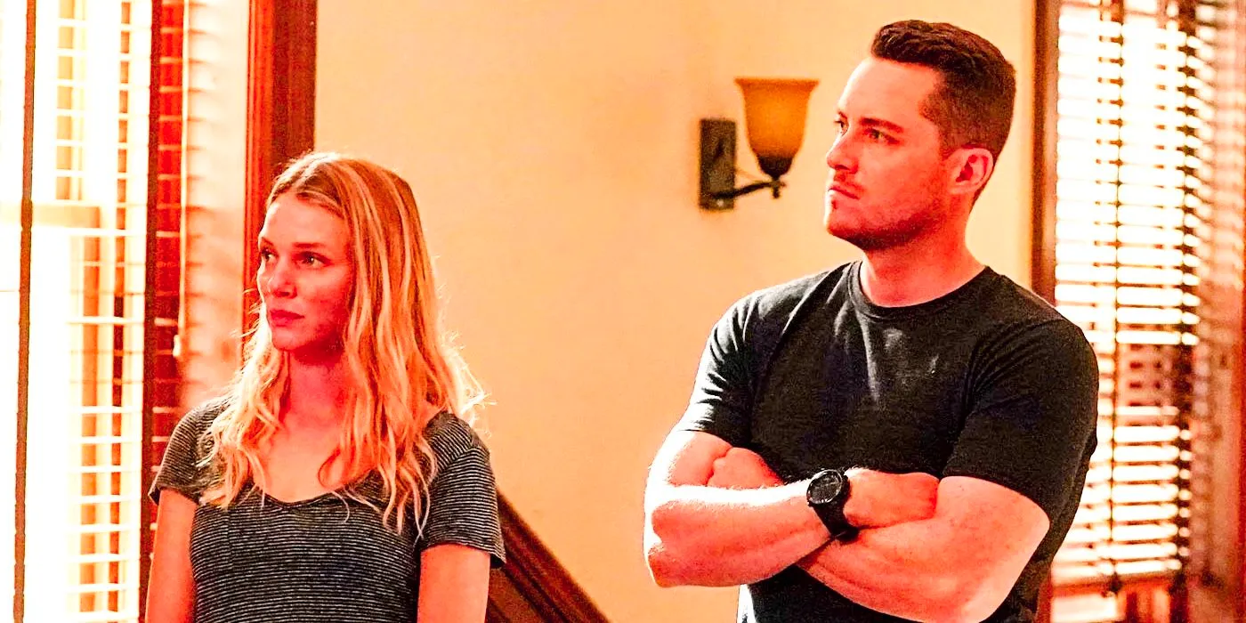 Chicago PD season 10 Halstead standing next to Upton in a brightly lit office, crossing his arms Image