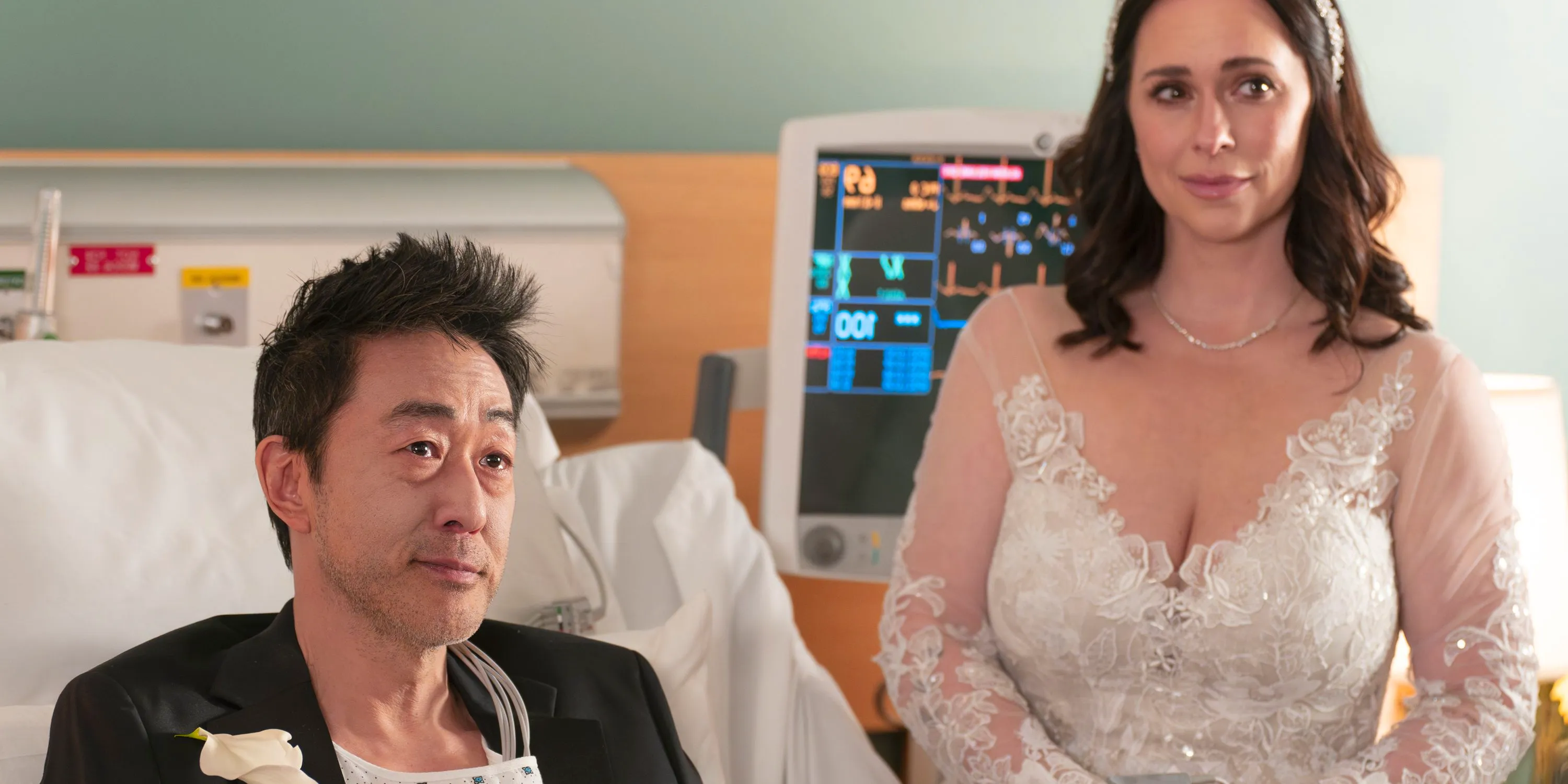 Chimney (Kenneth Choi) and Maddie (Jennifer Love Hewitt) getting married in 9-1-1. Image