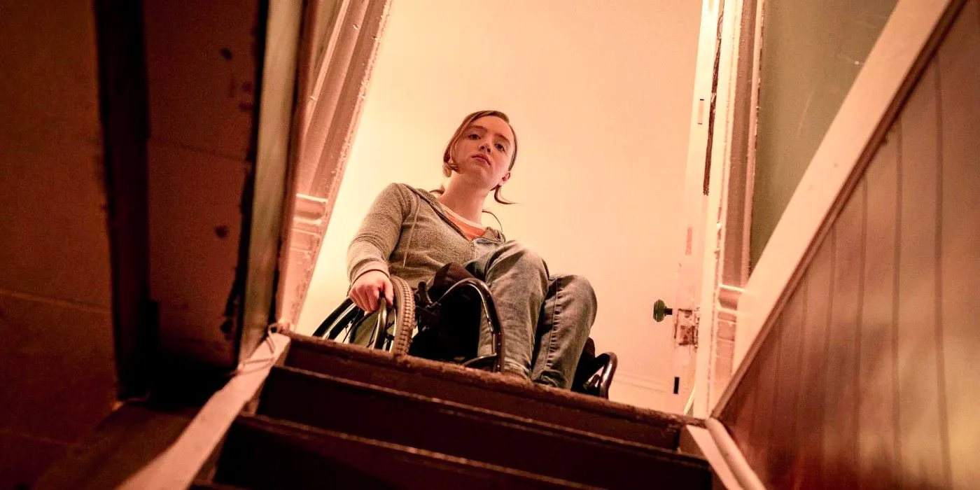 Chloe in a wheelchair at the top of the stairs in Run Image