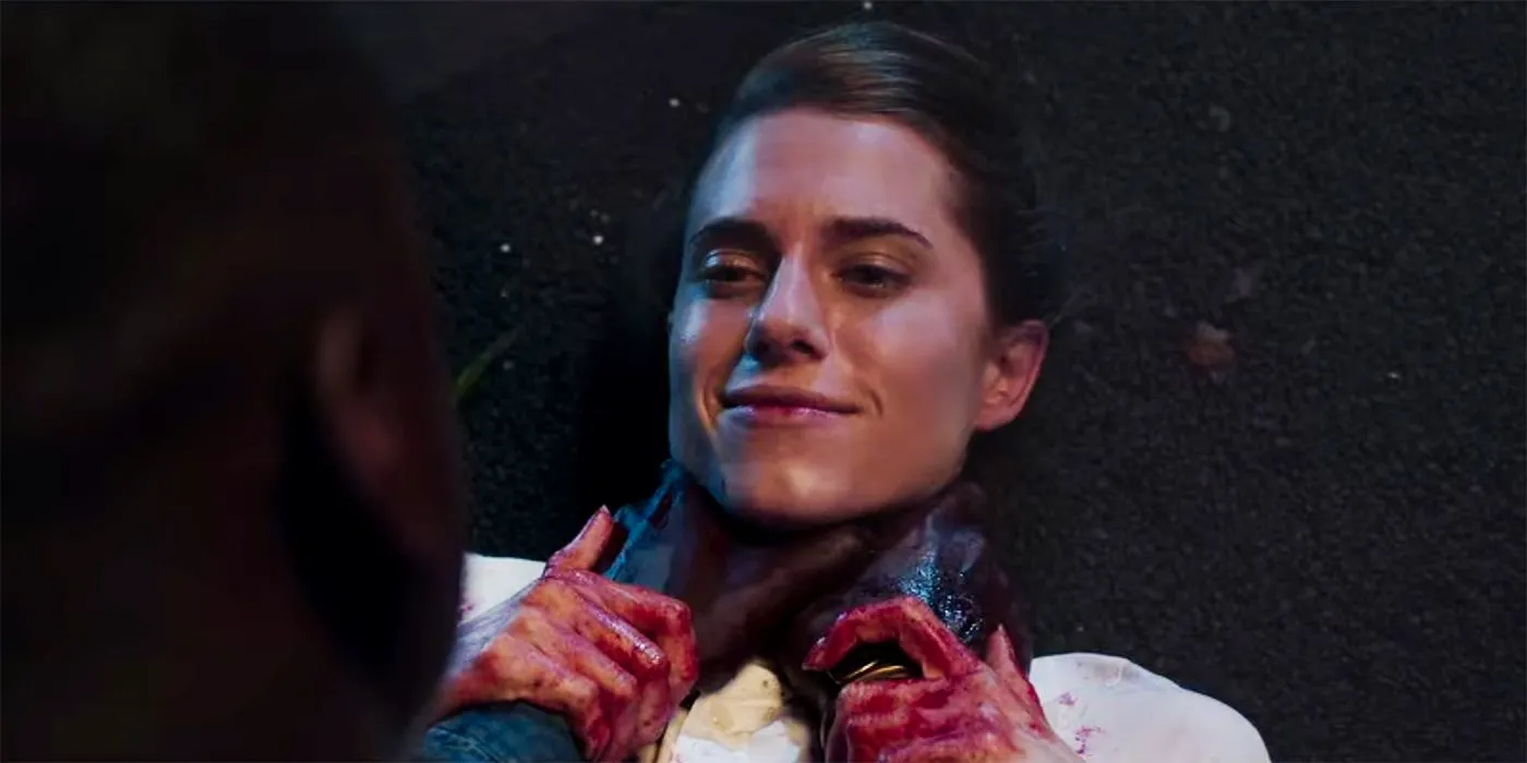 Chris (Daniel Kaluuya) choking a smiling Rose (Allison Williams) at the end of Get Out Image