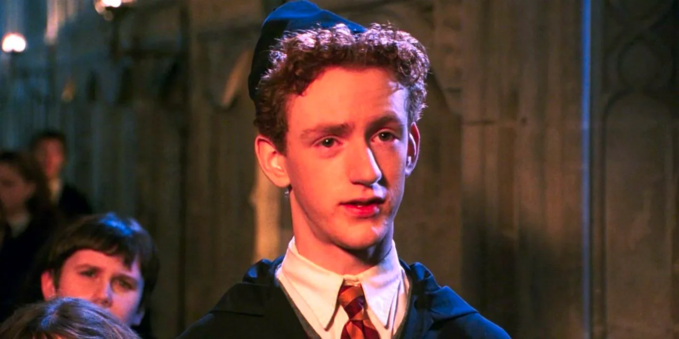 Chris Rankin as Percy Weasley reprimanding someone in Harry Potter. Image