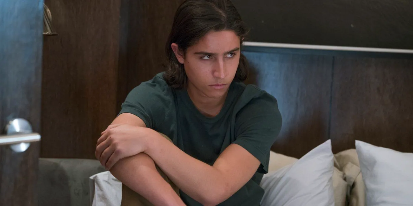 Chris sits on a bed in Fear the Walking Dead Image