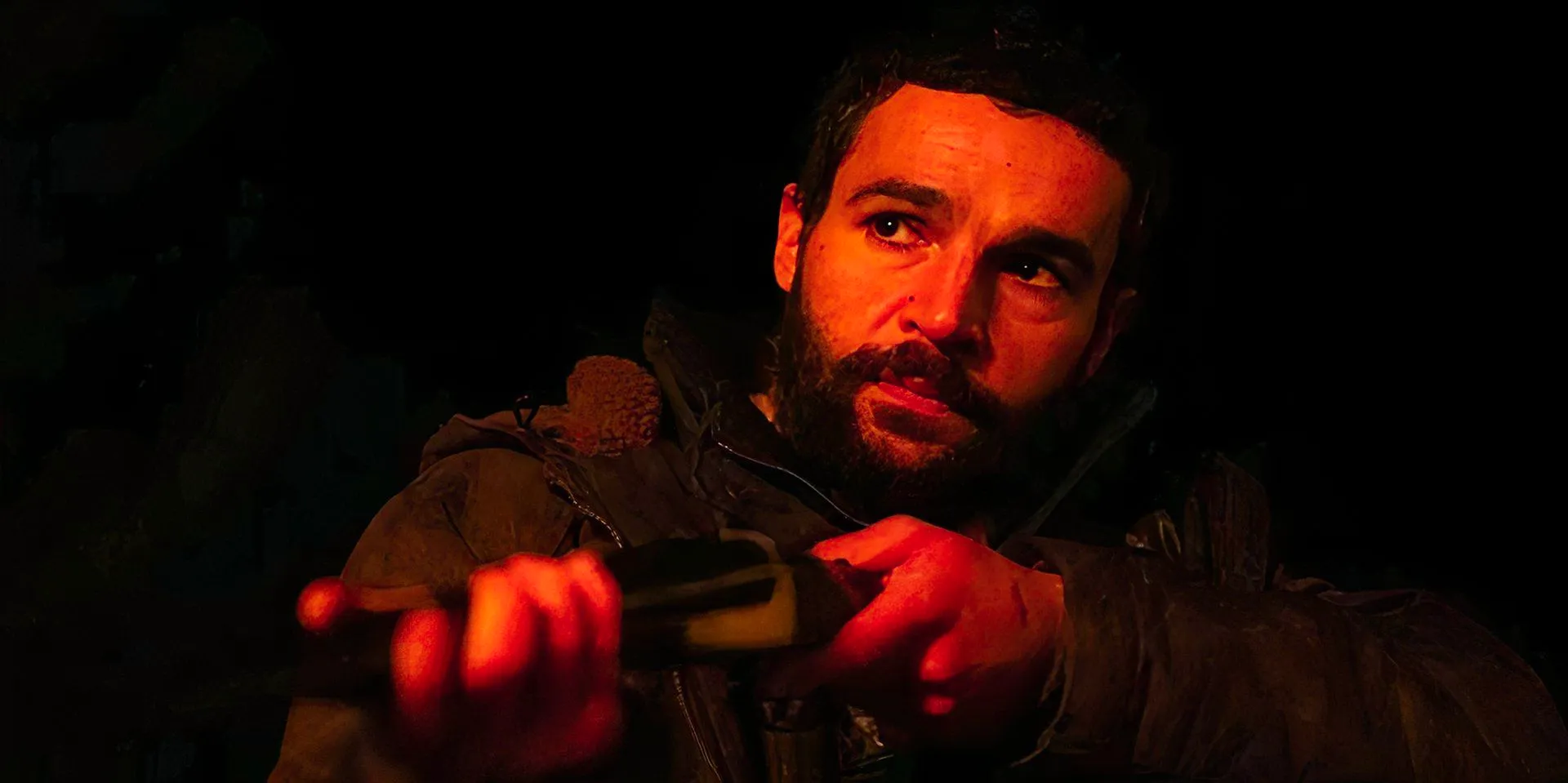 Christopher Abbott points a gun in Bring Them Down still Image