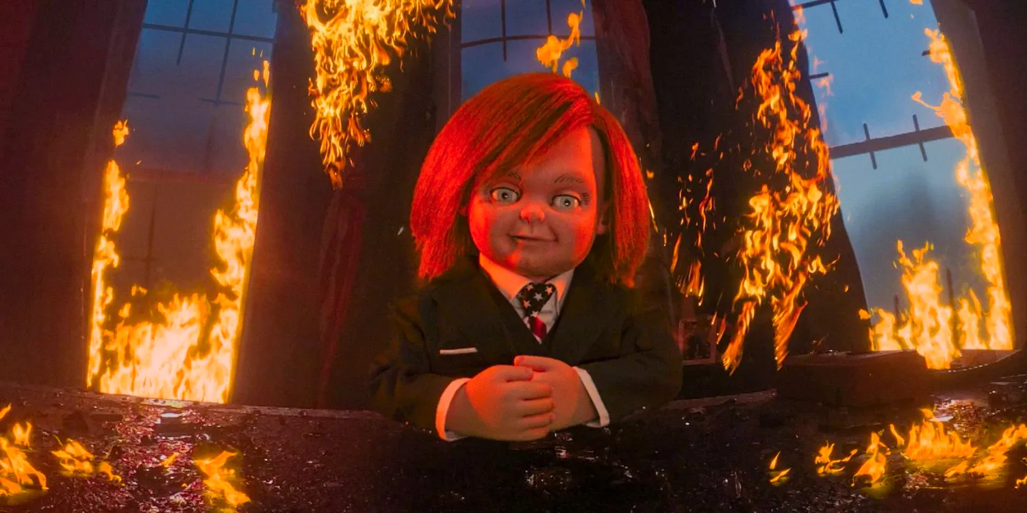 Chucky wearing a suit in the Oval Office, which is on fire in Chucky season 3 Pt 2, Ep 8 (FINALE) Image