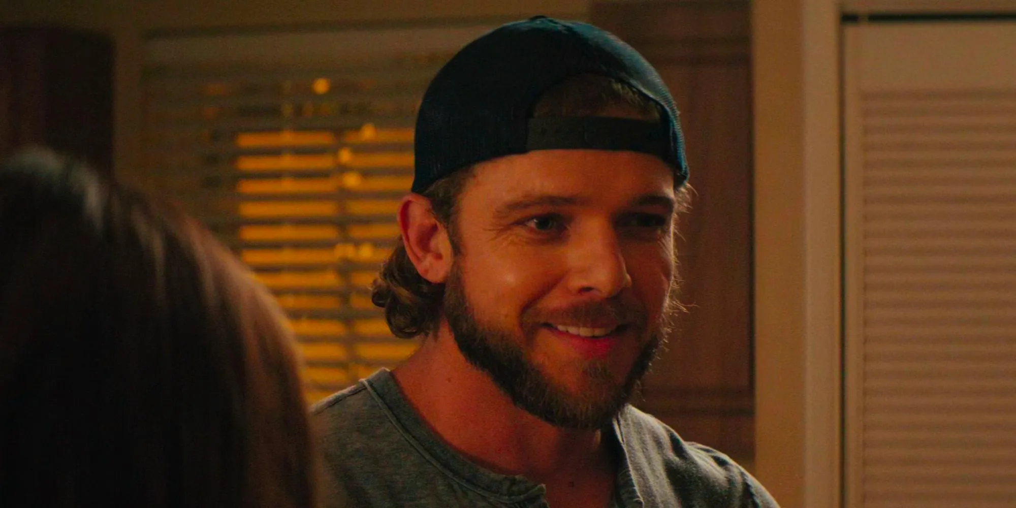 Clay (Max Thieriot) smiles at Stella (Alona Tal) on SEAL Team Season 6 Episode 8 Image