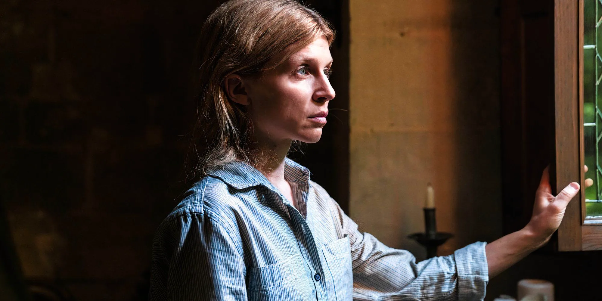 Clémence Poésy as Isabelle looking out a window in Daryl Dixon season 2 Image