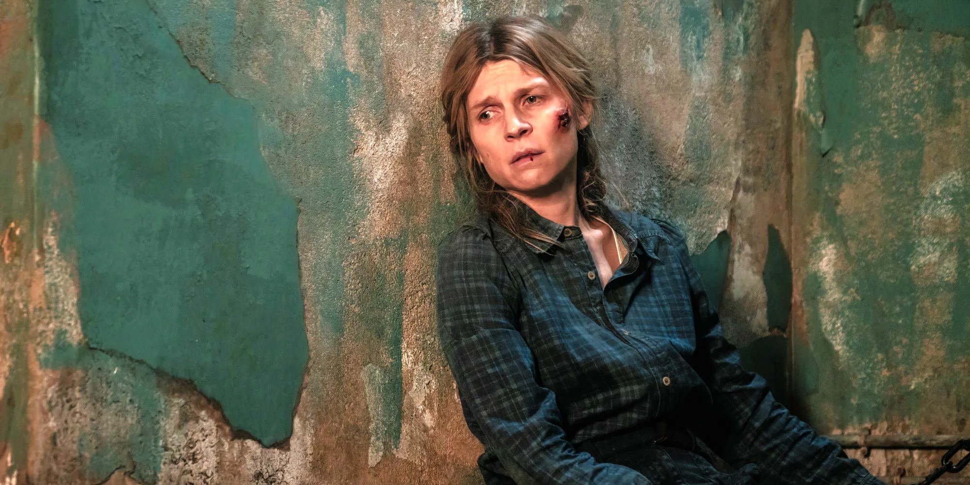 Clémence Poésy as Isabelle sitting against a wall in her cell in Walking Dead Daryl Dixon season 2 Image