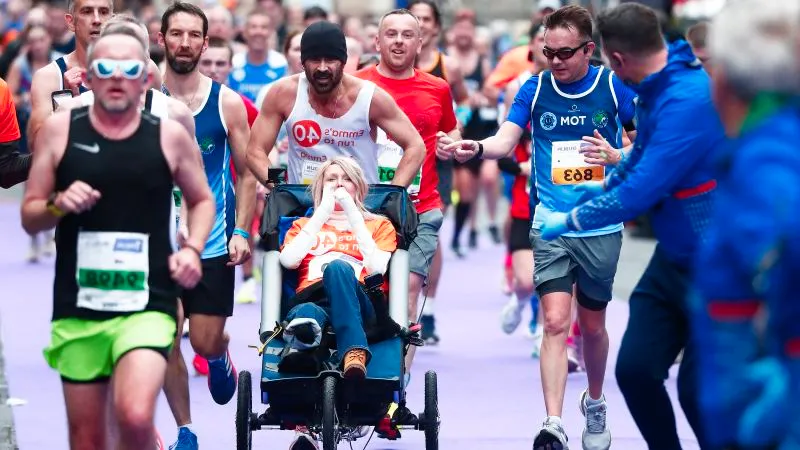 Colin Farrell finishes Dublin Marathon while pushing friend in a wheelchair Image