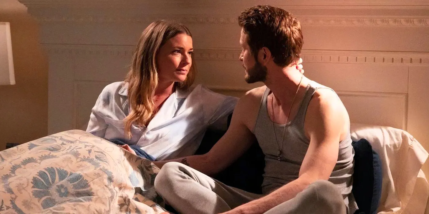 Conrad (Matt Czuchry) and Nic (Emily VanCamp) sitting on a bed together in a flashback in The Resident. Image