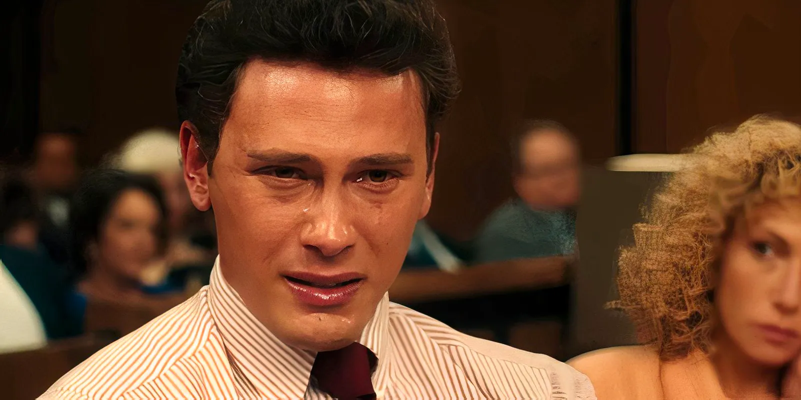 Cooper Koch as Erik crying in the courtroom in Monsters: The Lyle and Erik Menendez Story Image