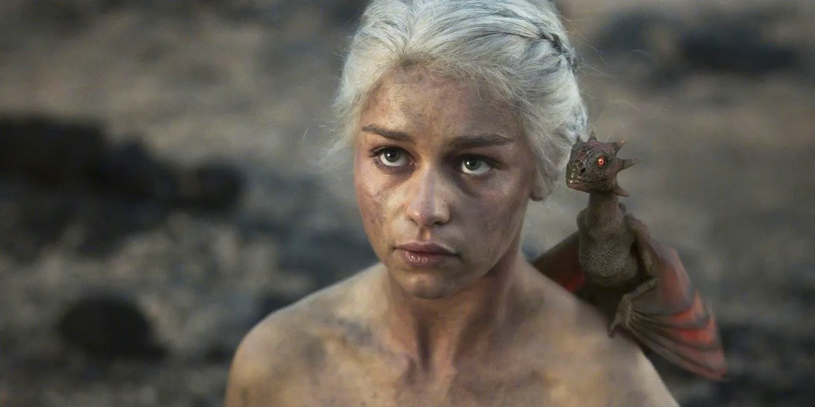 Daenerys (Emilia Clarke) with baby Drogon on her shoulder in Game of Thrones season 1, episode 10 Image