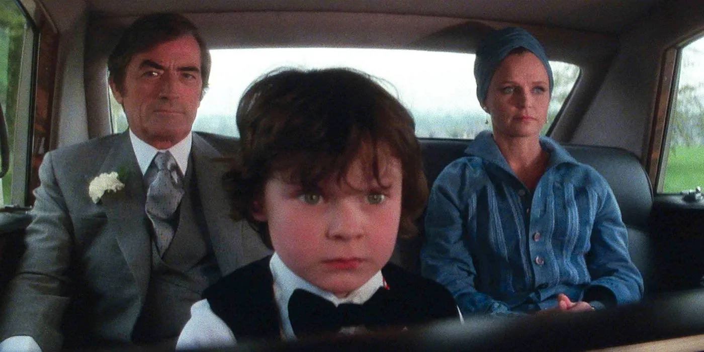 Damien and his parents in a car in The Omen Image