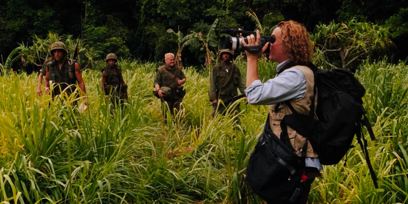 Damien holding a camcorder in Tropic Thunder. Image