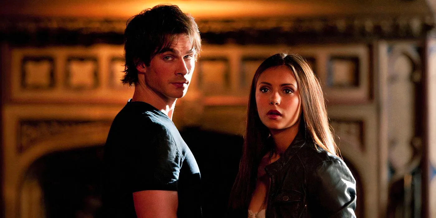 Damon and Elena looking at something on The Vampire Diaries Image