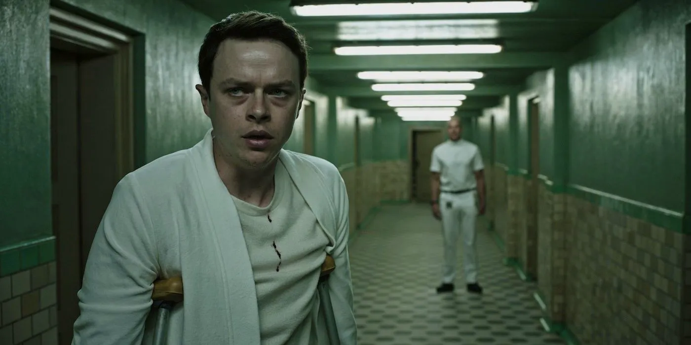 Dane DeHaan in a hallway in A Cure for Wellness (2017) Image