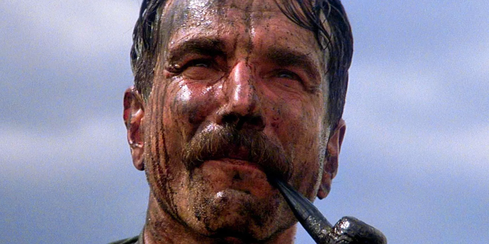 Daniel Plainview (Daniel Day-Lewis) covered in oil in There Will Be Blood. Image