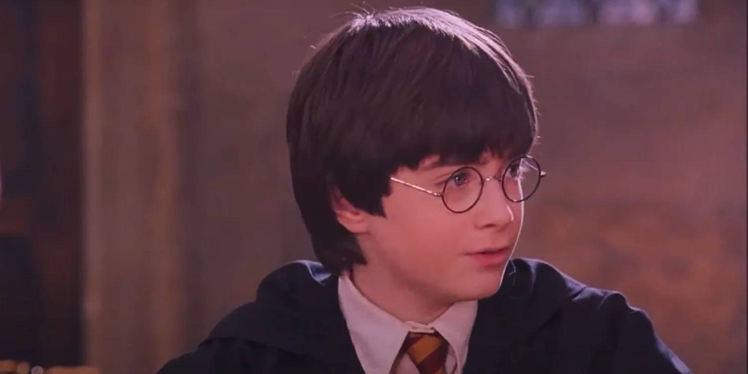 Daniel Radcliffe as Harry Potter looking at Professor McGonagall in Sorcerer's Stone Image