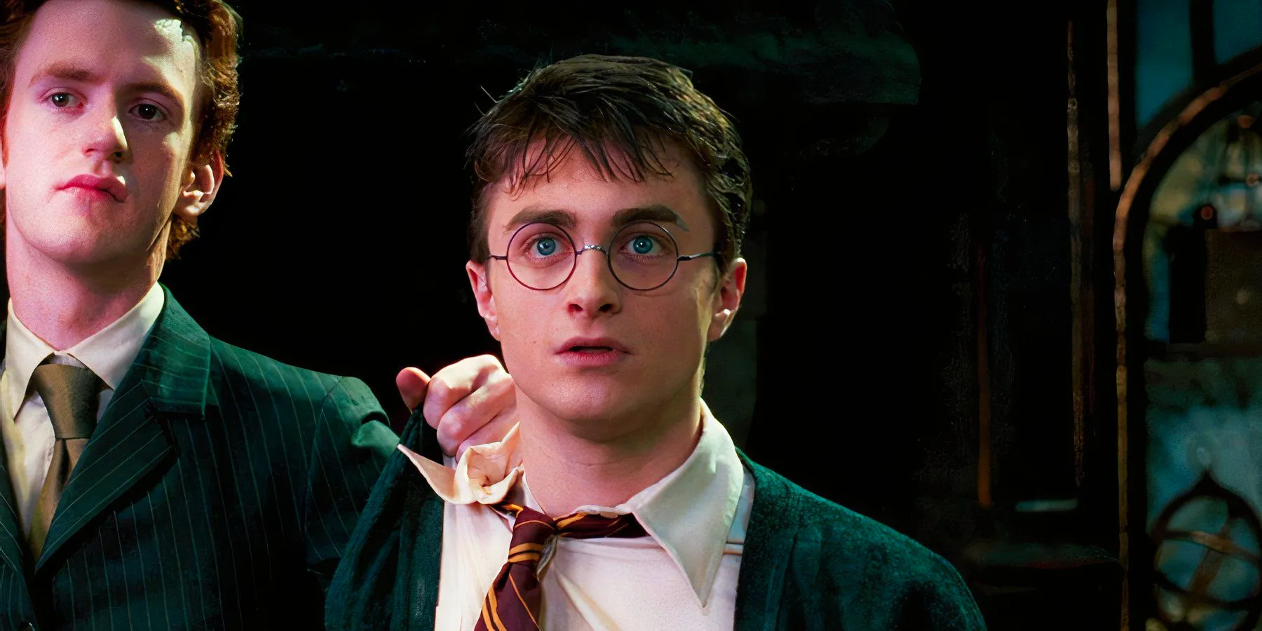 Daniel Radcliffe as Harry Potter looking nervous with Percy (Chris Rankin) placing his hand on his shoulder in Harry Potter and the Order of the Phoenix Image