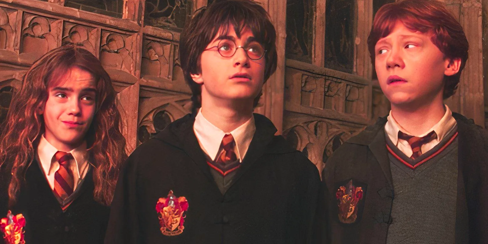 Daniel Radcliffe as Harry, Rupert Grint as Ron, and Emma Watson as Hermione in Harry Potter and the Chamber of Secrets Image