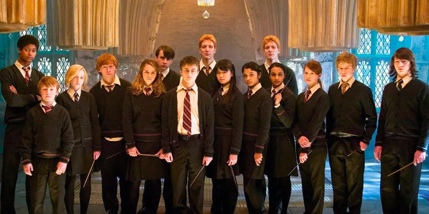 Daniel Radcliffe, Rupert Grint, and Emma Watson as Harry, Ron, and Hermione pose with members of Dumbledore's Army in Harry Potter 5. Image